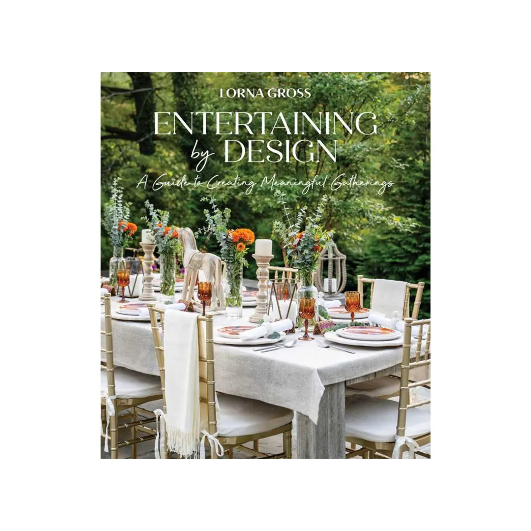 Book cover of 'Entertaining by Design' with a table setting outdoors.