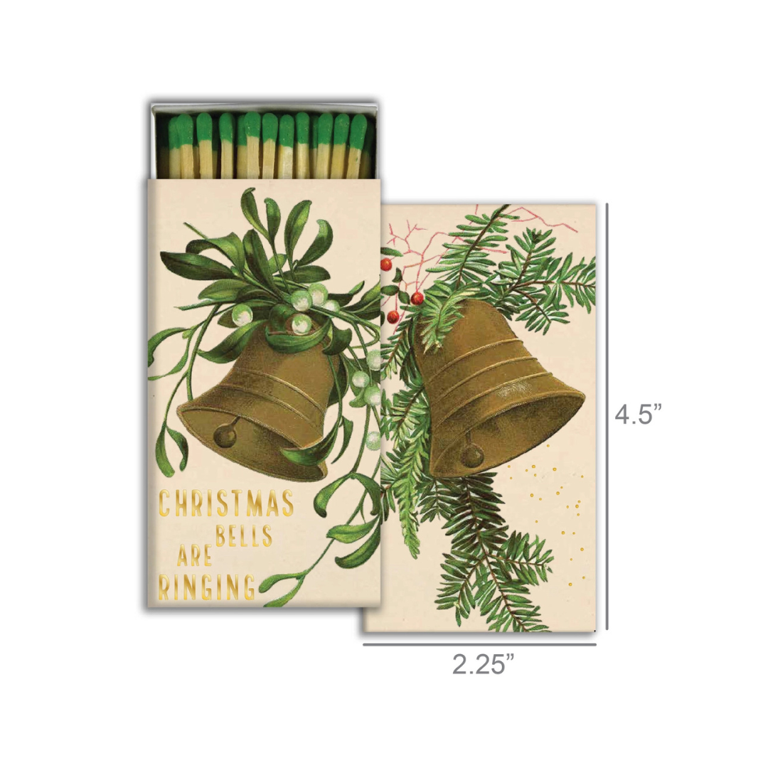 Matchbox with Christmas design featuring bells and greenery, with dimensions displayed.