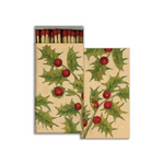 Matches with holly design on a beige background