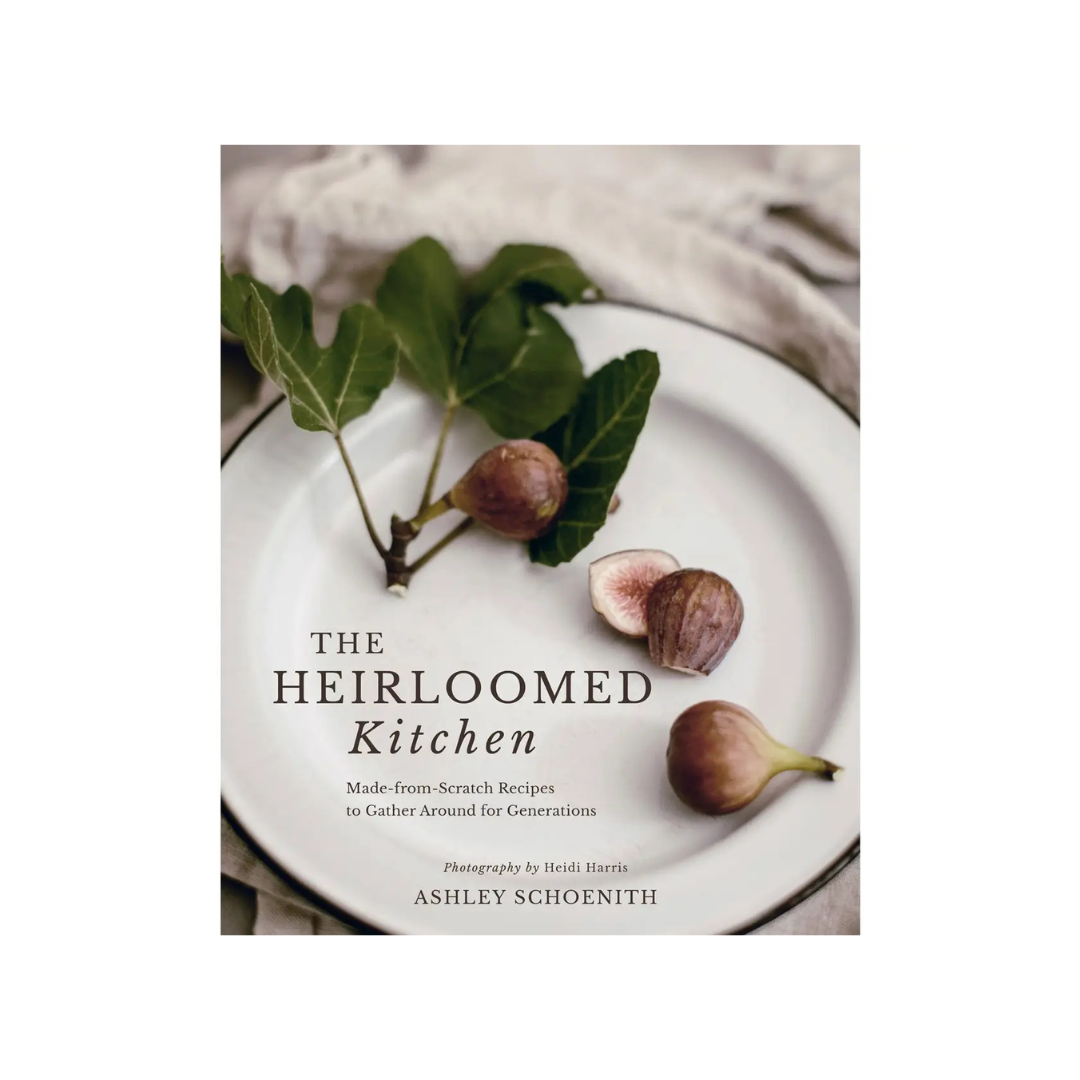 Book cover of 'The Heirloomed Kitchen' with figs on a plate