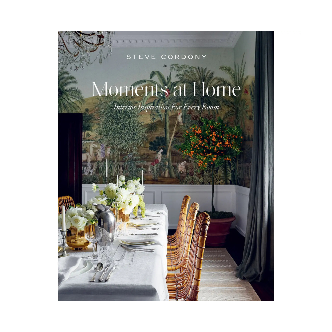 Book cover of 'Moments at Home' by Steve Cordony with a dining room scene.