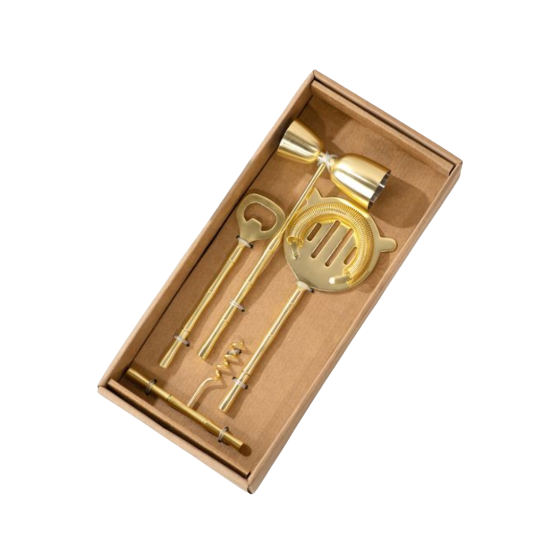 Gold bow tie and microphone-shaped clip in a brown box on a white background