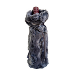 Fur-wrapped wine bottle on a white background