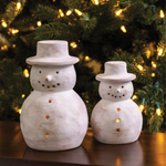 whitewashed terracotta snowman, two sizes, in front of a christmas tree