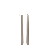 Two gray candles on a white background