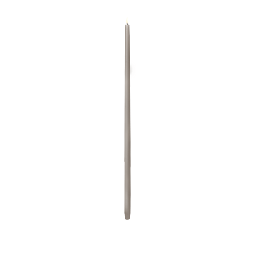 Long, thin gray flameless candle on a white background