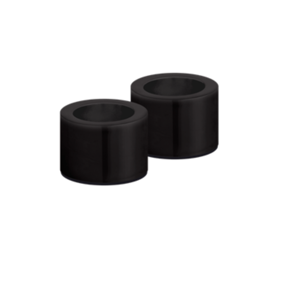 Two black cylindrical rubber bushings on a white background