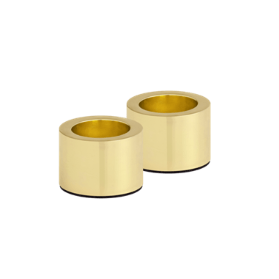 Two gold cylindrical objects on a white background