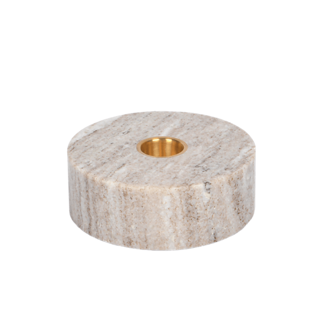 Marble candle holder with gold interior on a white background