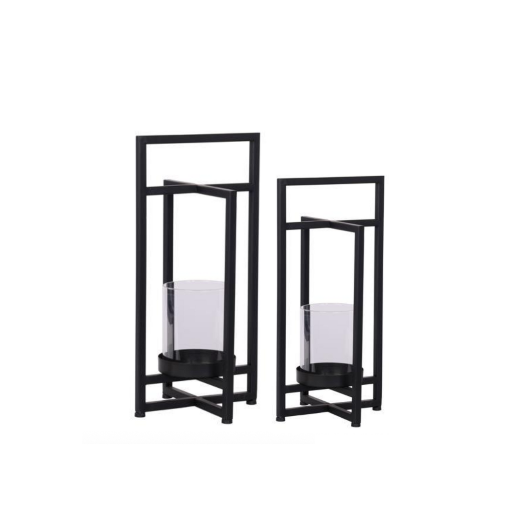 Two black metal candle holders with glass containers on a white background