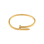 Gold bangle on a white background
