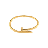 Gold bangle on a white background