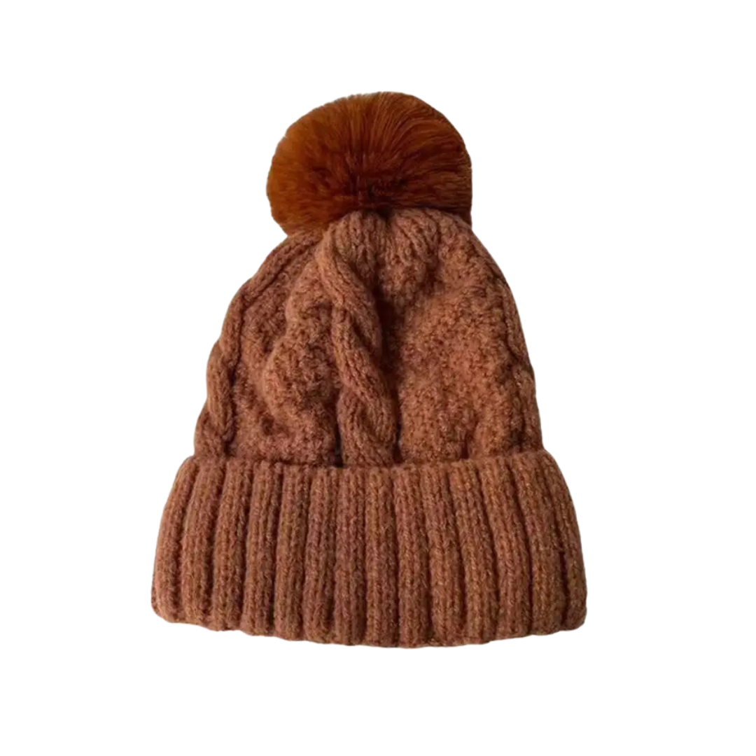 Brown knit beanie with a pom-pom on a white background