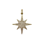 Gold star-shaped pendant with embedded stones on a white background