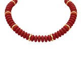 red beaded necklace with gold spacer accents on a white background