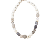Neutral-toned beaded necklace featuring a mix of matte, marbled, and clear beads in shades of grey, taupe, and ivory displayed on a white background