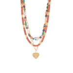 Layered beaded necklace with coral, turquoise, and gold beads, featuring a gold heart pendant and mixed textures on a white background