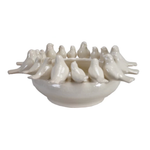 Ceramic bowl with decorative birds on a white background