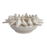 Ceramic bowl with decorative birds on a white background