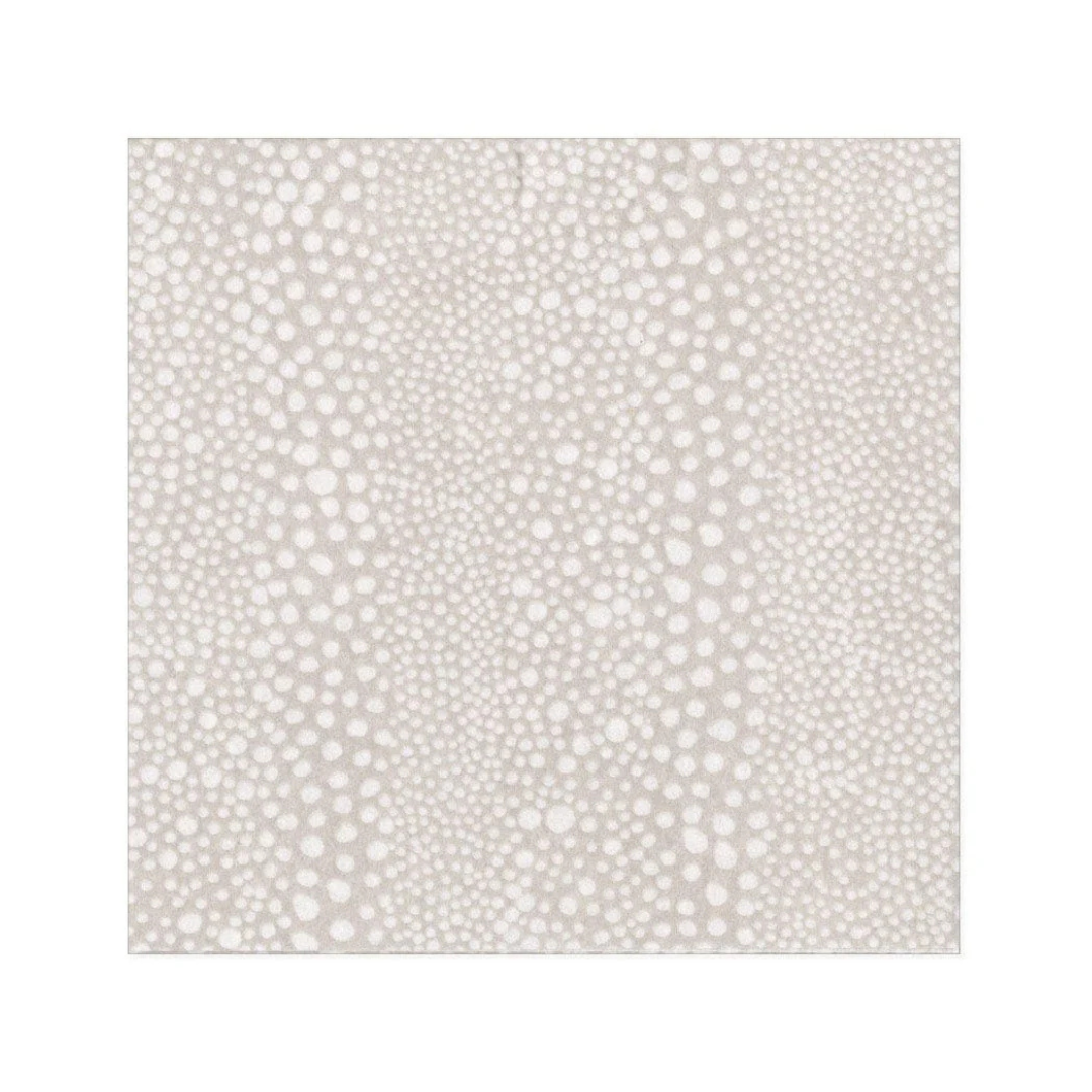 Patterned luncheon napkin with small white dots on a beige background