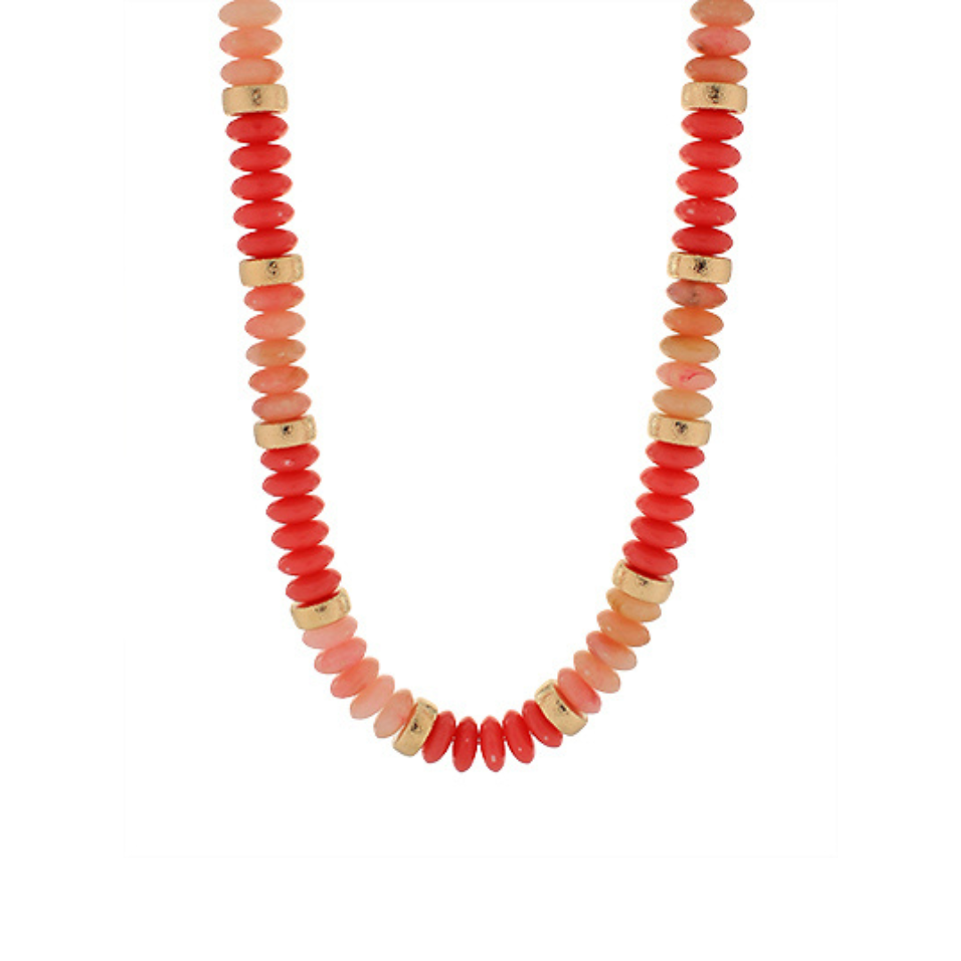 Necklace with red and gold beads on a white background