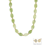 Necklace with green beads on a white background