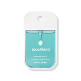 Touchland power mist hand sanitizer packaging on a white background