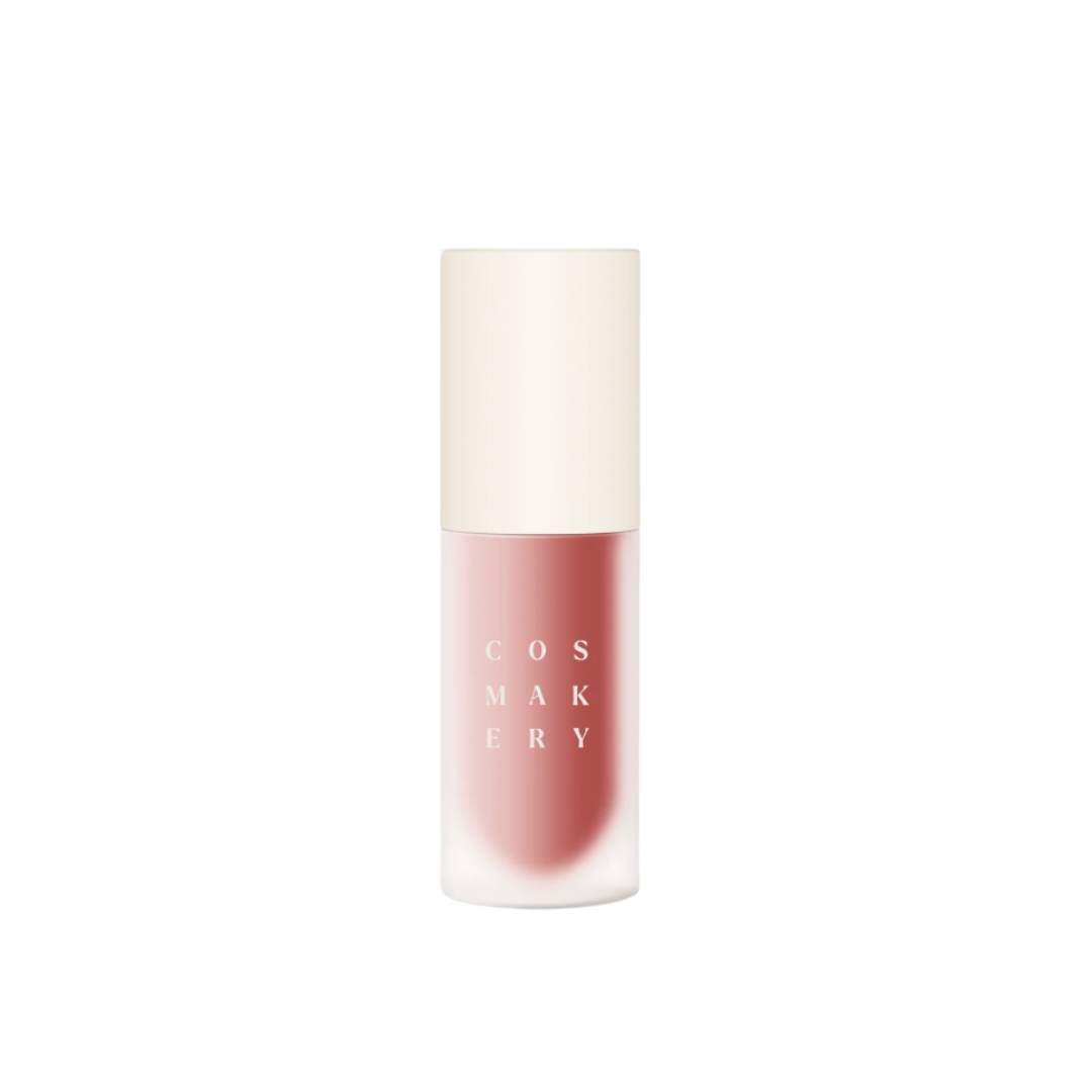 Cosmetics bottle with pink liquid on a white background