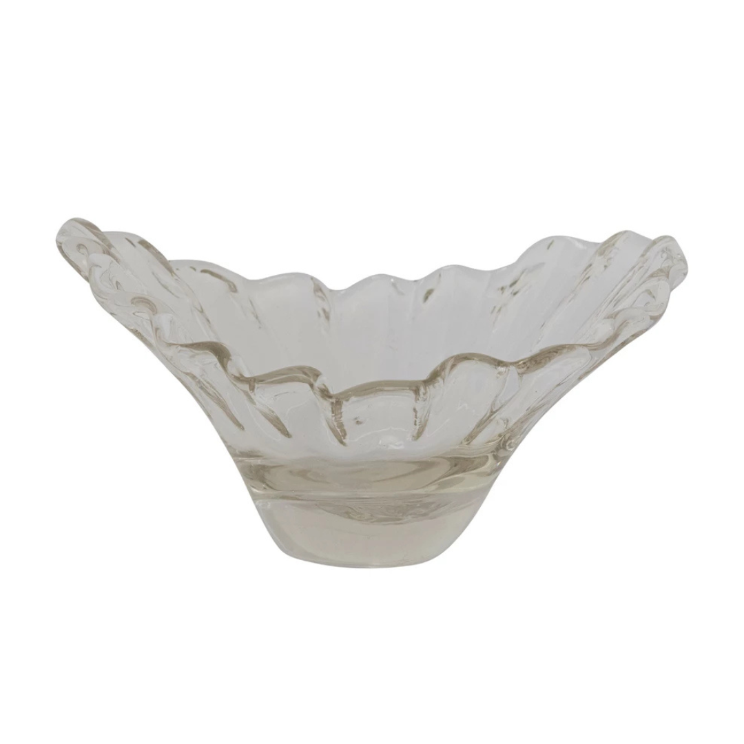 Decorative glass bowl with wavy edge on a white background
