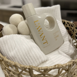 LAVANT bottle with bath bombs and towels in a basket