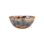 Decorative glass bowl with marbled pattern on a white background