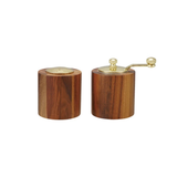Wooden salt and pepper shakers with gold accents on a white background