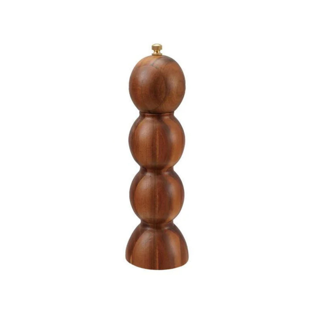 Wooden pepper grinder on a white background