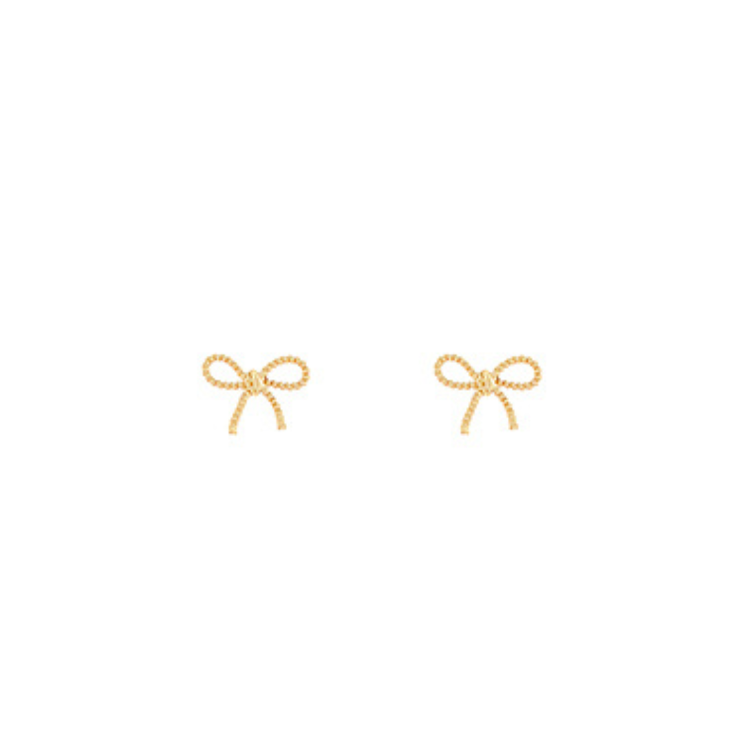 Gold bow-shaped earrings on a white background