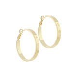 Gold hoop earrings with engraved nail head detailing, photographed on a white background.