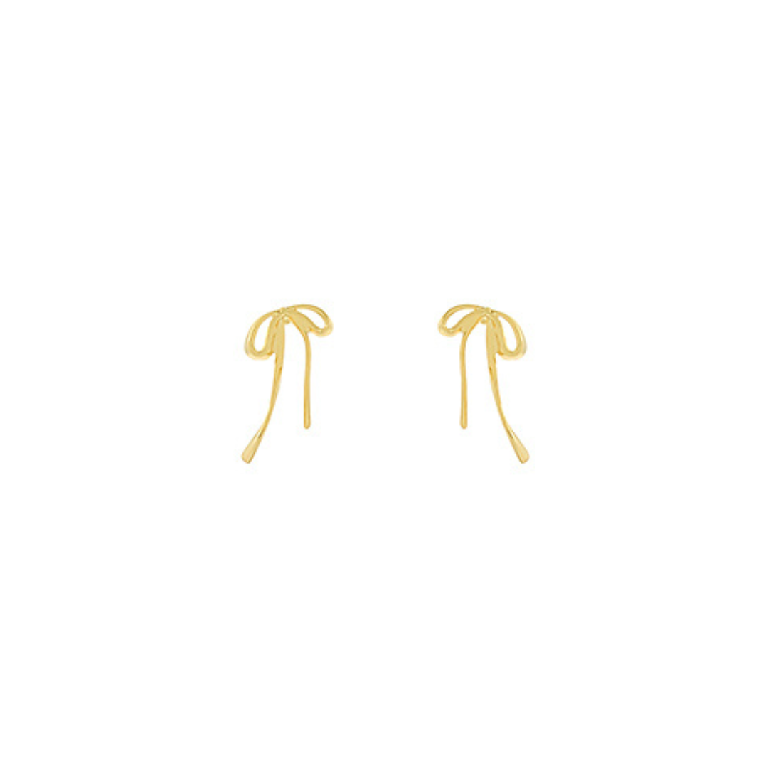 Delicate gold-dipped bow stud earrings with a minimalist design, photographed on a white background.