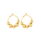 Gold hoop earrings featuring graduated multi-sized ball details along the front, photographed on a white background.
