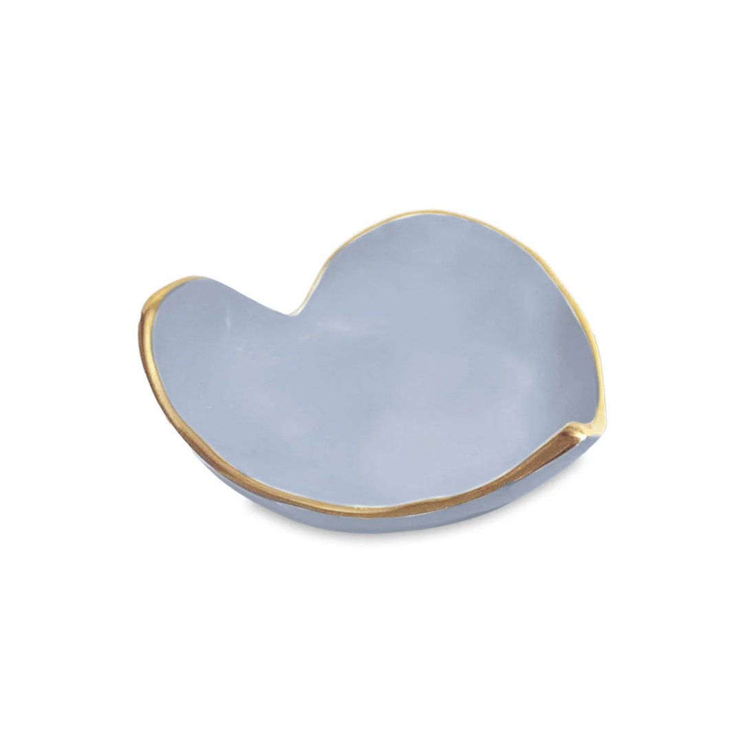 Blue heart-shaped dish with gold rim on a white background