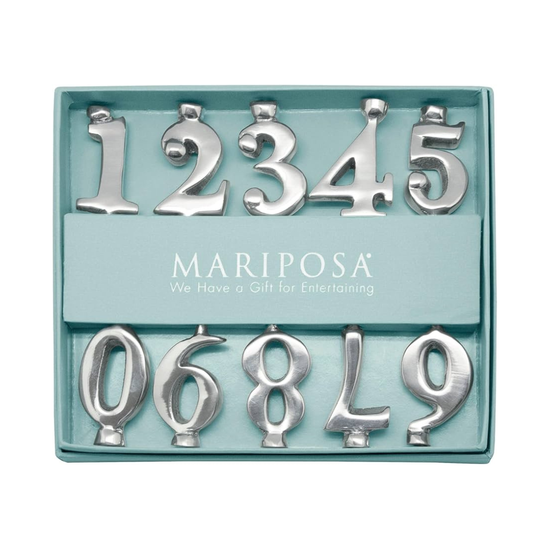 Set of silver metal numbers in a Mariposa packaging on a white background
