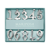 Set of silver metal numbers in a Mariposa packaging on a white background