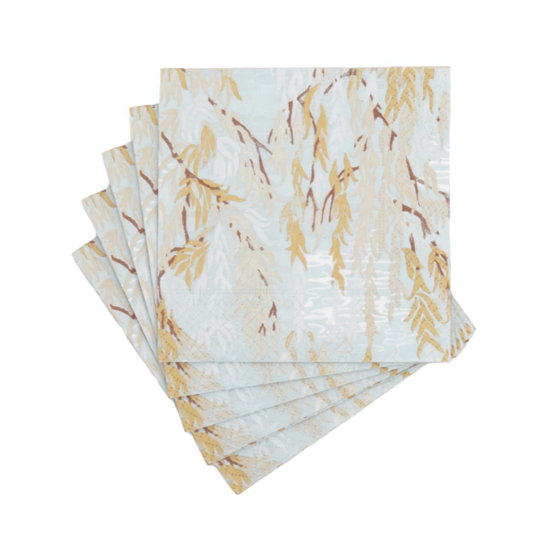 Set of four napkins with a gold leaf pattern on a white background