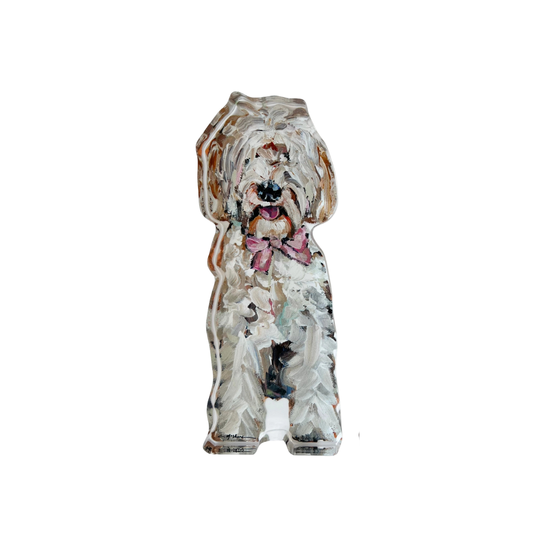 Decorative dog figurine with a patterned coat on a white background