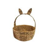 Woven basket with bunny ears on a white background