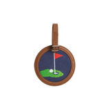Round embroidered golf bag tag with golf design on a white background