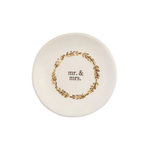 wedding ring dish with 'mr. & mrs.' text and gold wreath on a white background