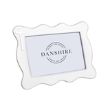 White decorative photo frame with 'Danshire' logo on a white background