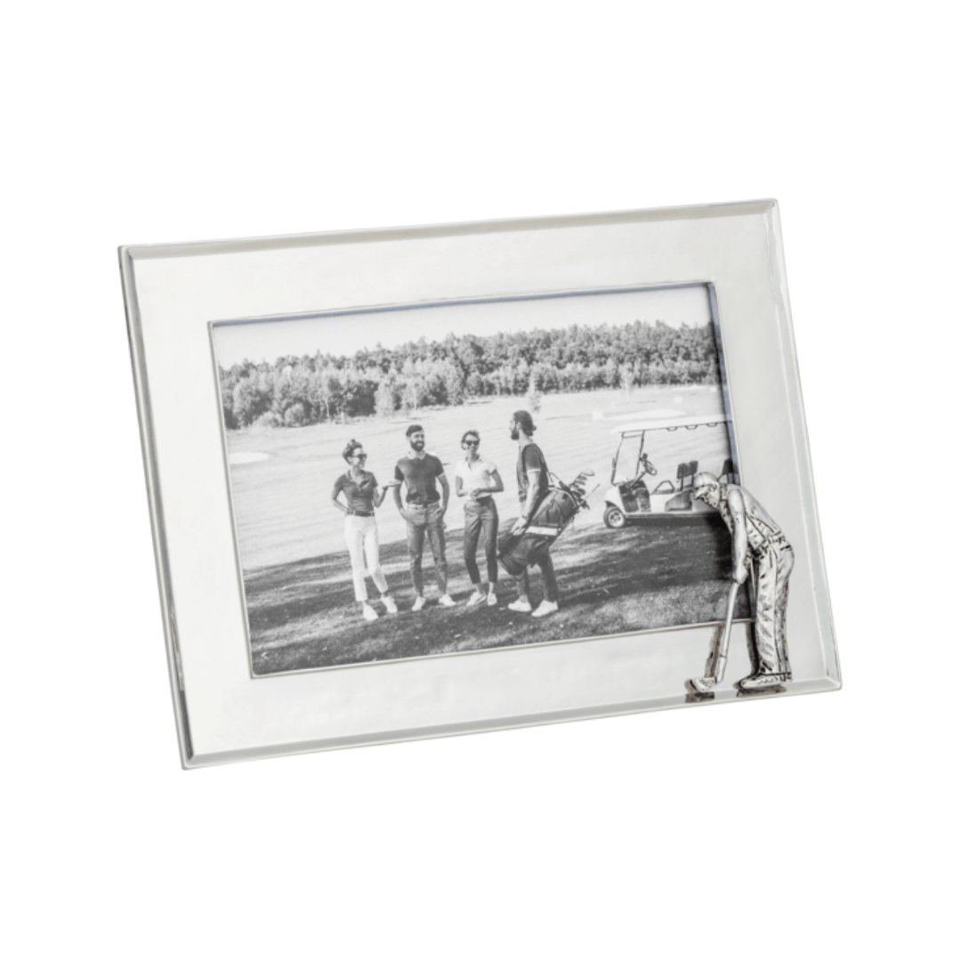 Silver picture frame with a black and white photo of people on a field.
