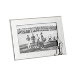 Silver picture frame with a black and white photo of people on a field.