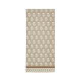 Beige towel with white floral pattern on a white background