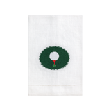 White towel with a golf ball design in the center on a white background